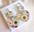 Daisy confetti double heart drop hoop earrings.