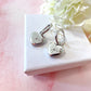 Silver Heart Engraved star Huggie hoop earrings.