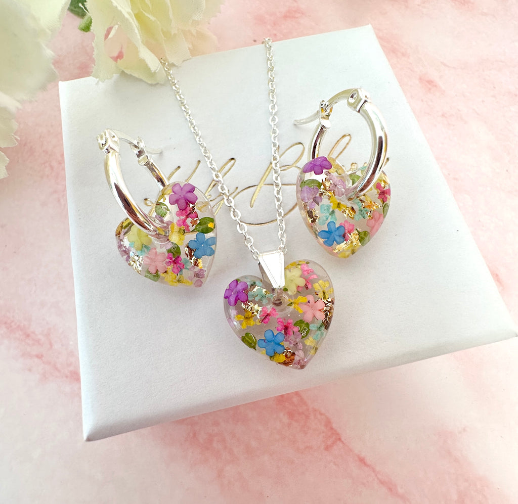 Silver Rainbow Burst bloom Heart necklace.