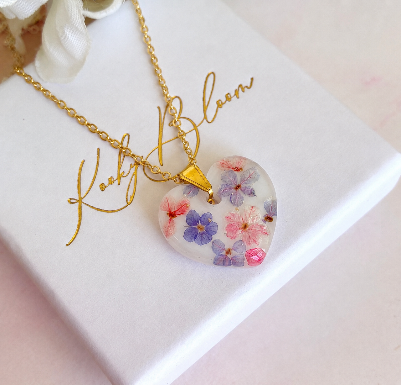 Gold Marshmallow Bloom Heart necklace.