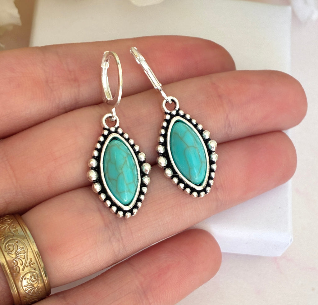 Silver Turquoise stone horse eye huggie earrings.