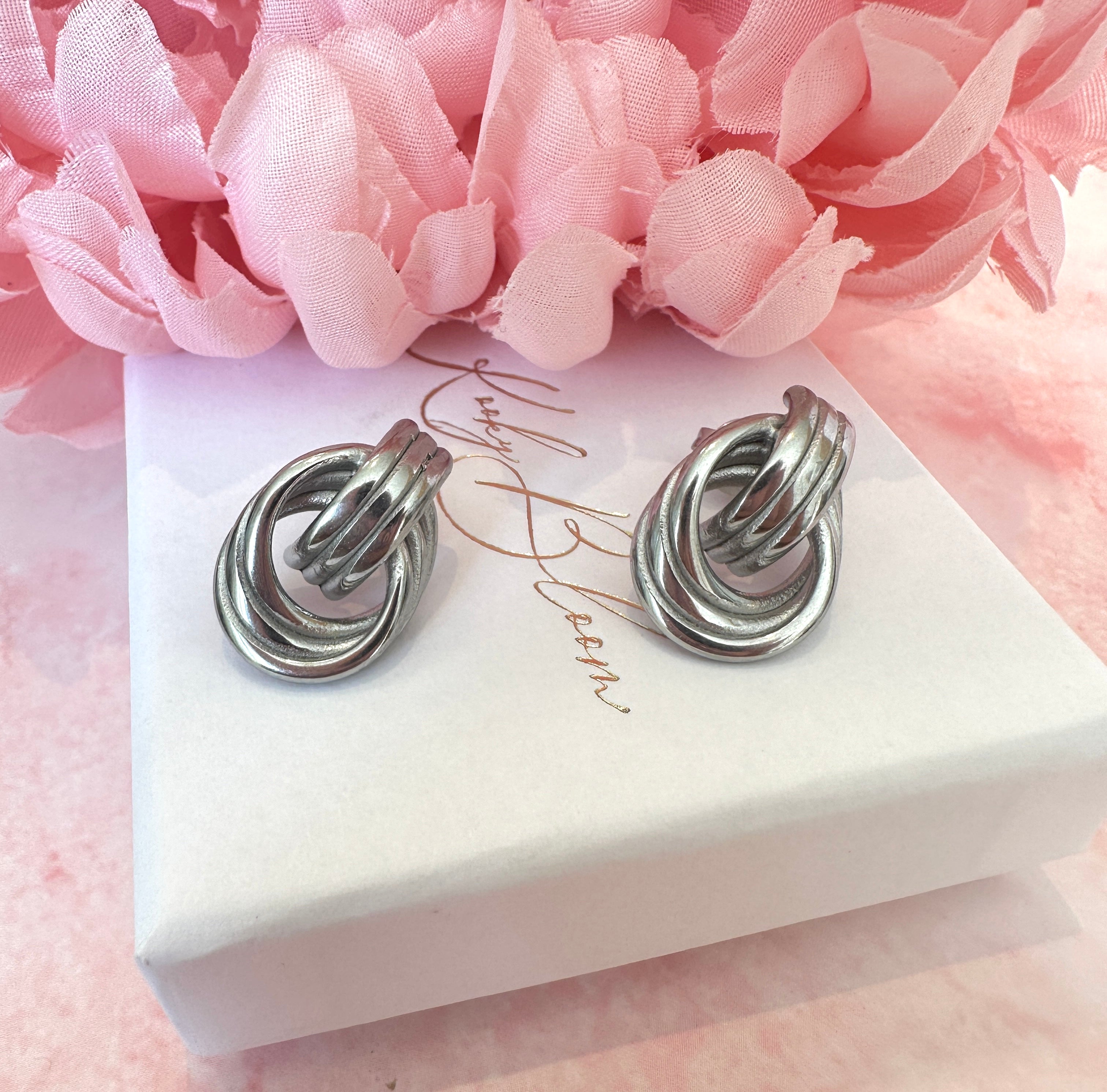 Silver Loop chunky stud earrings.