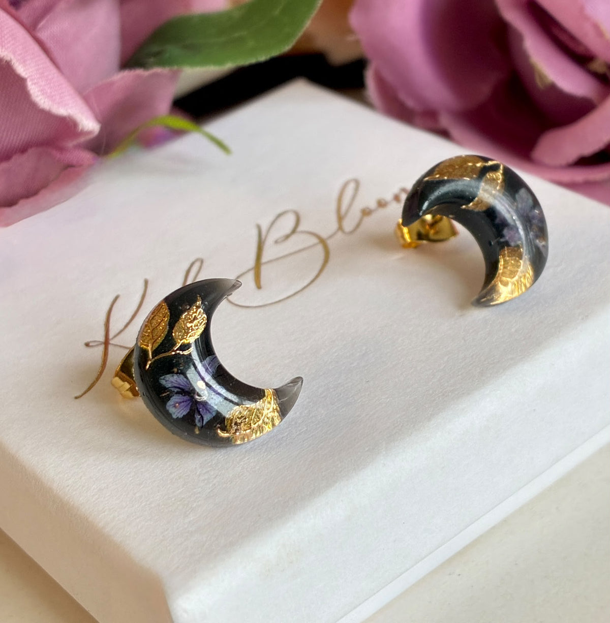 Mystical Dark Bloom Moon stud earrings.