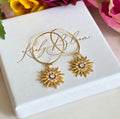 Gold CZ Star sun ray earrings.