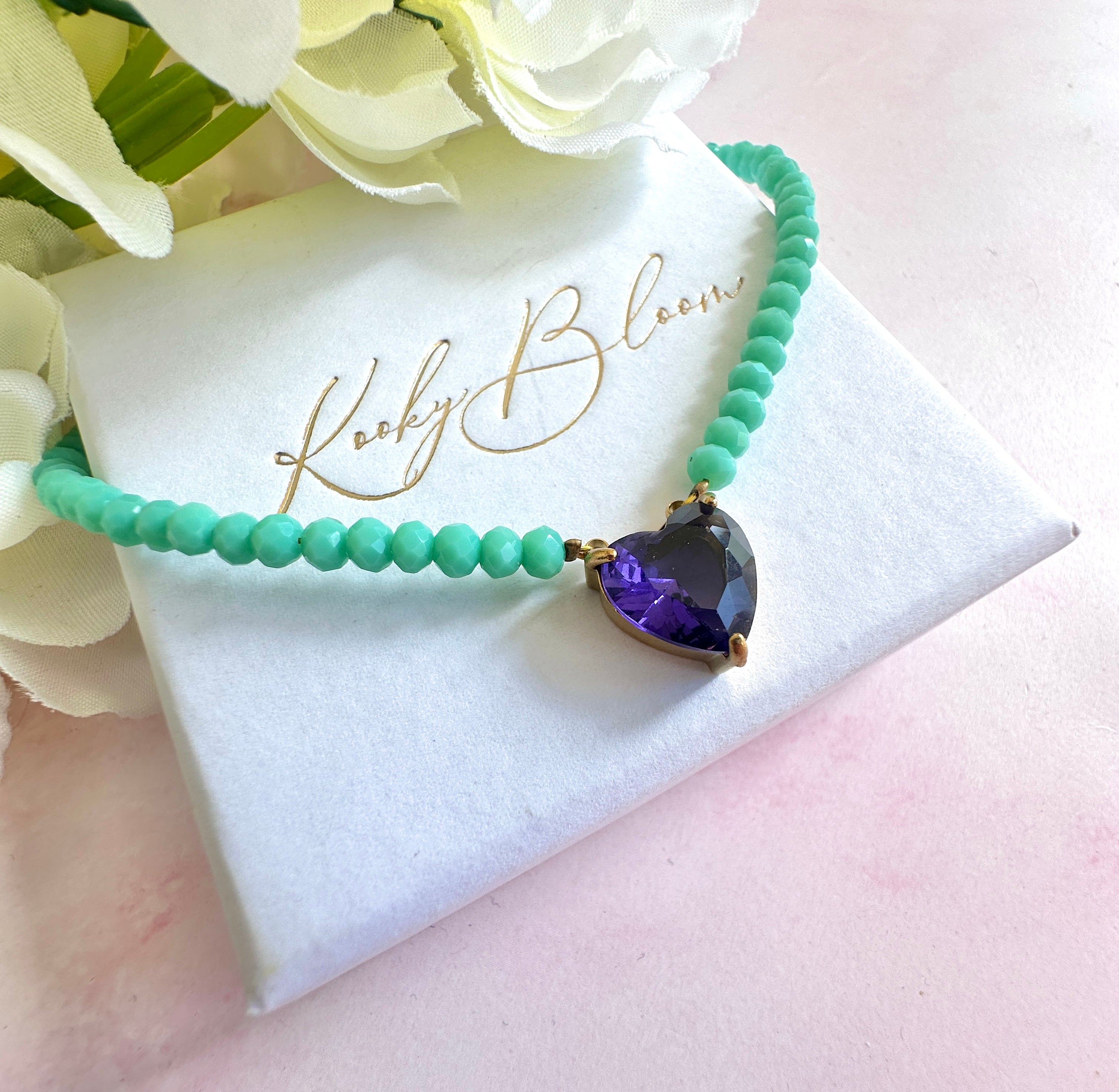 Gold turquoise beaded Purple CZ heart necklace.