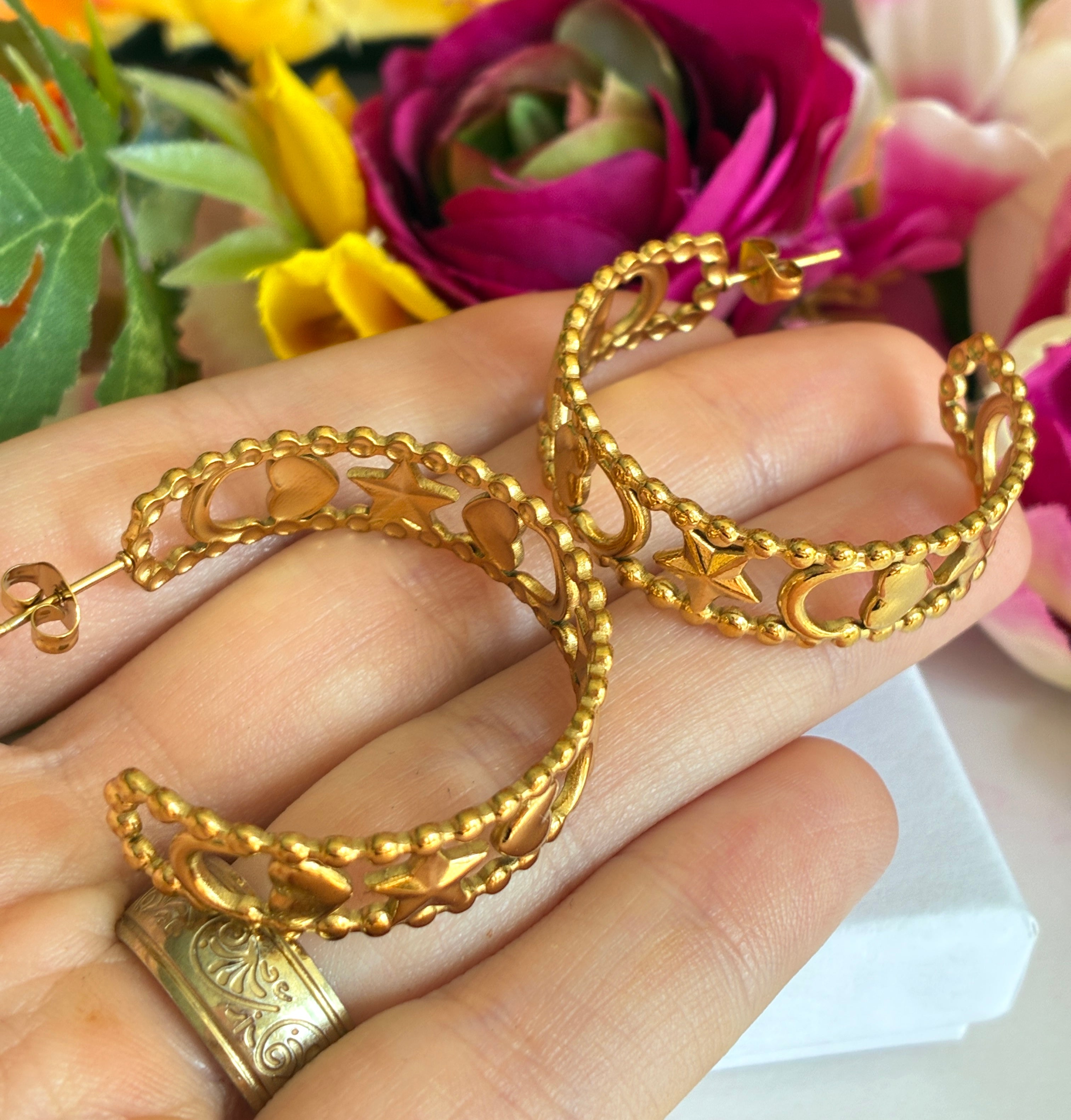Gold star moon heart hoop earrings.