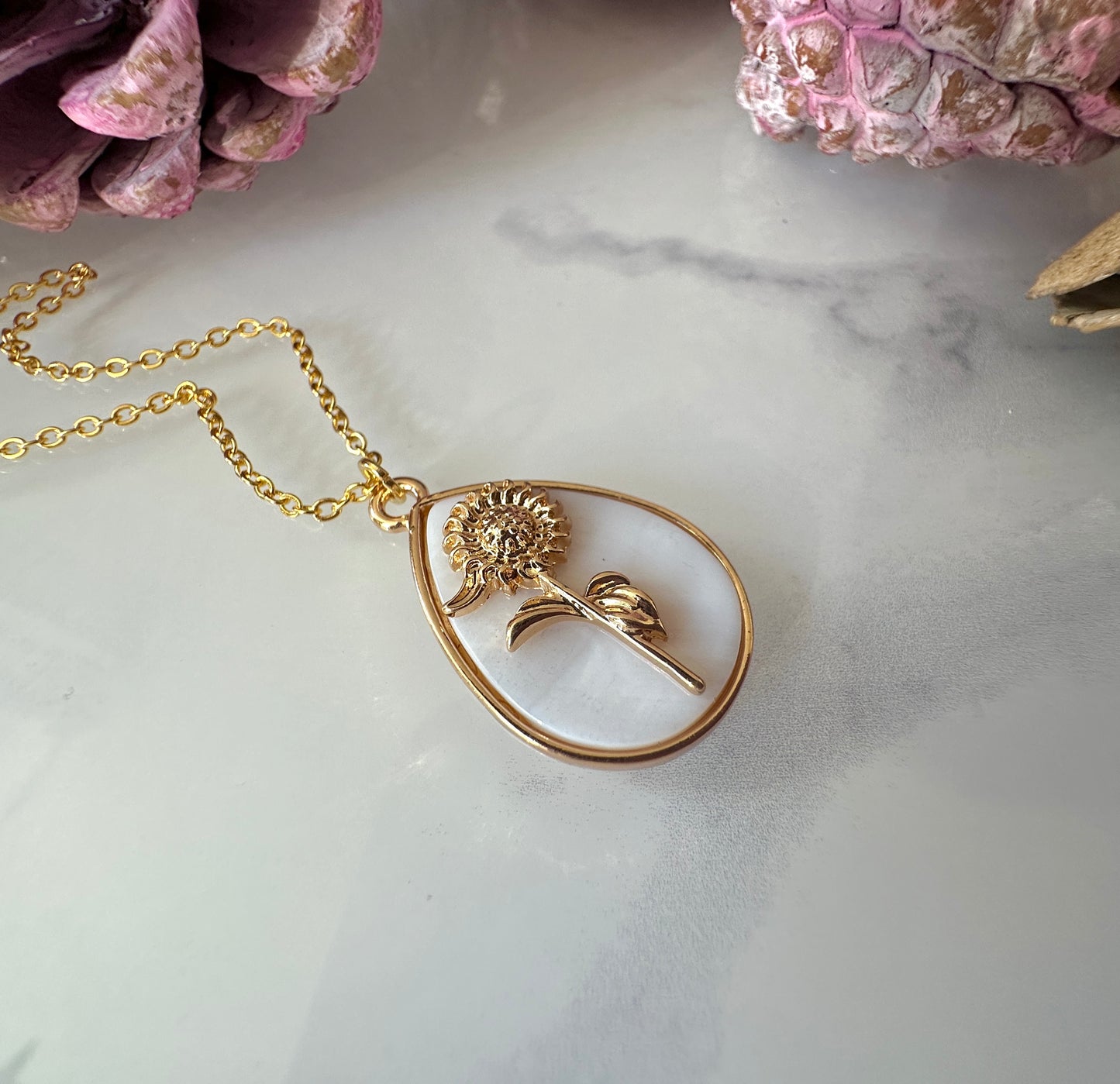 Gold Sunflower Shell Teardrop necklace.