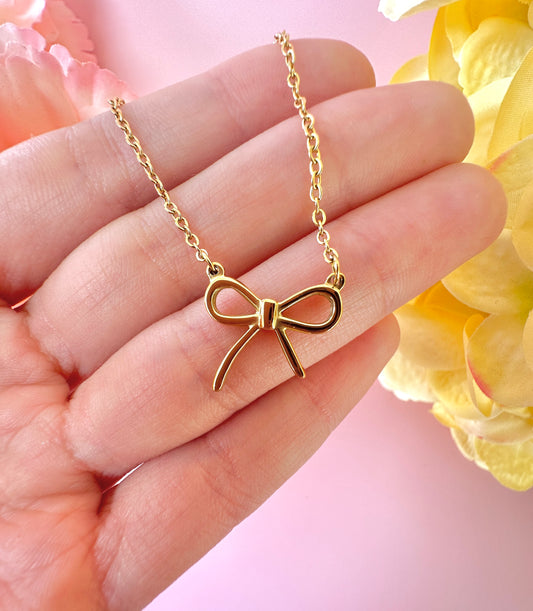 Gold Bow necklace.