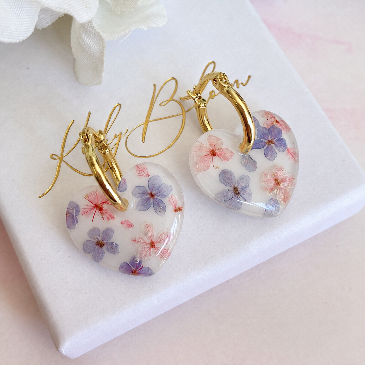 Marshmallow bloom heart earrings.