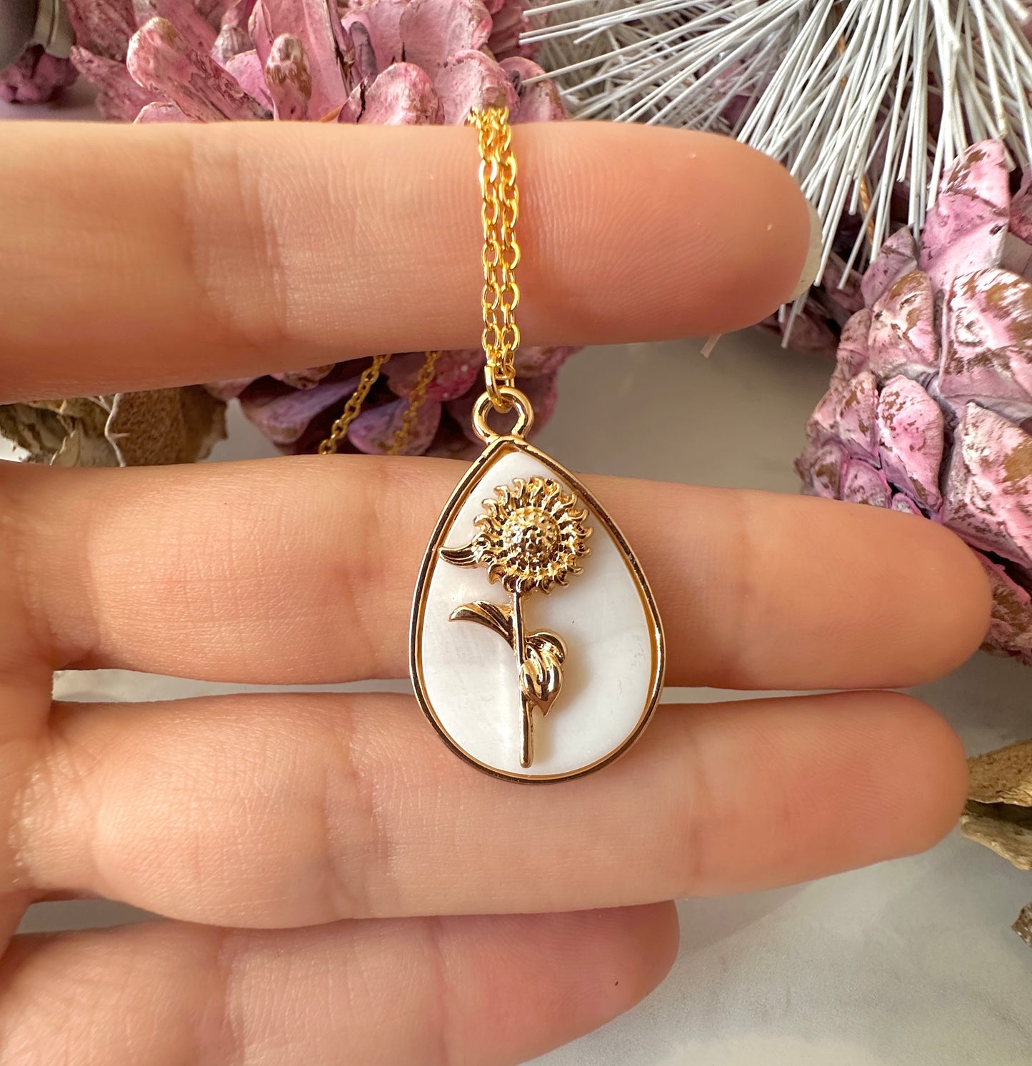 Gold Sunflower Shell Teardrop necklace.