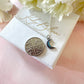 Silver tiny blue stone Moon necklace.