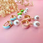 Gold Enamel Pearl drop Huggie earrings.