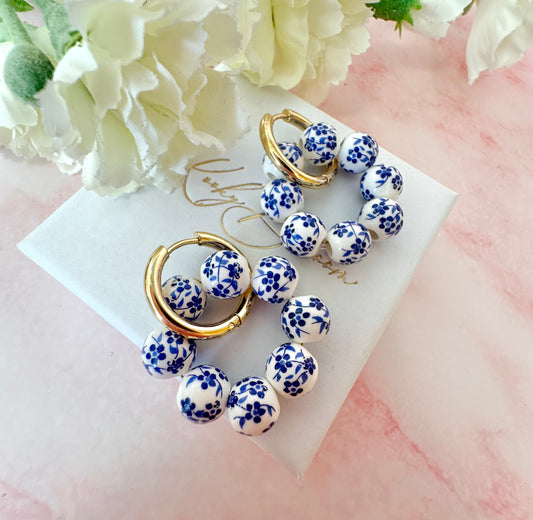 Gold Blue White floral bead ring hoop earrings.