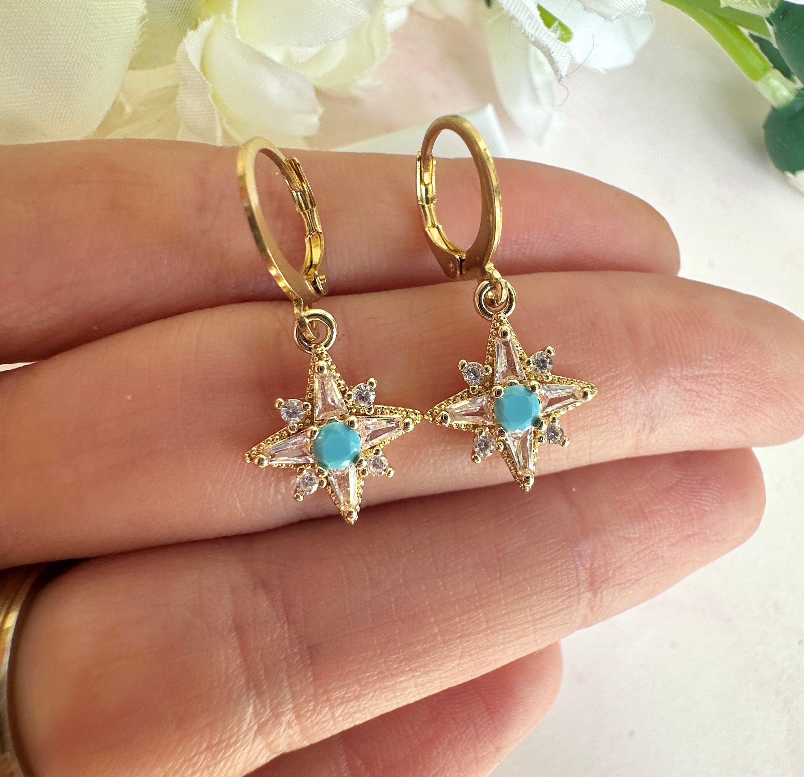 Gold Tiny Cz Blue stone Star huggie earrings.