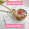 Gold real flower capsule locket necklace.