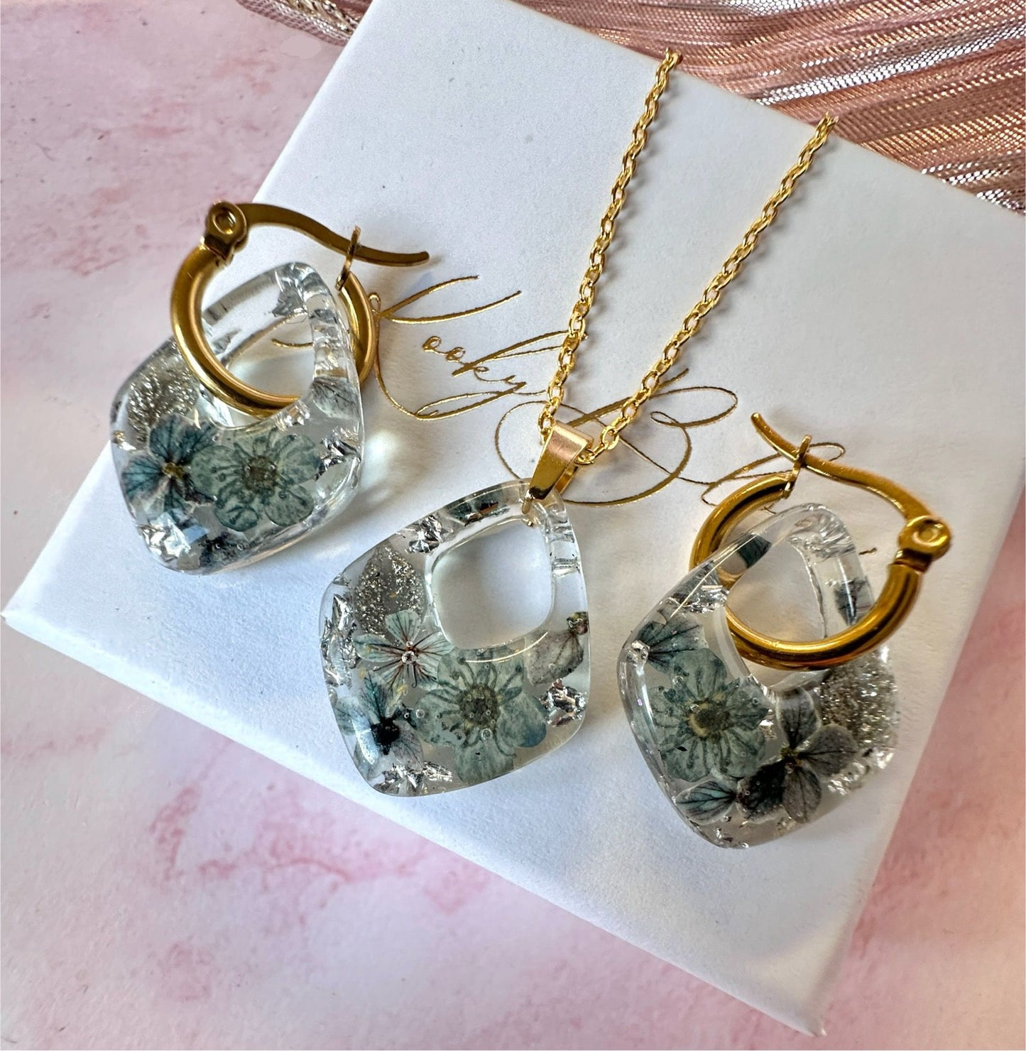 Gold Frosted floral grey diamond necklace.