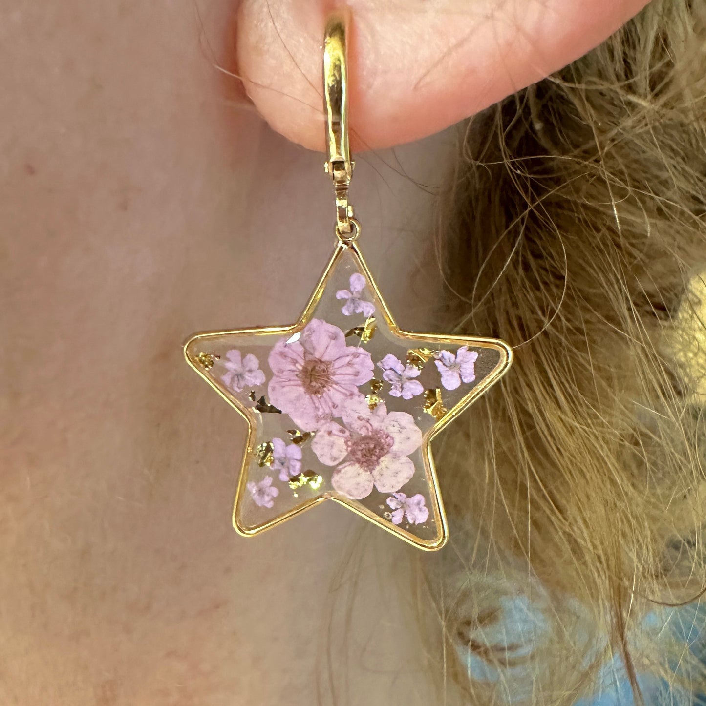 Lilac Bloom Star Gold Huggie earrings.