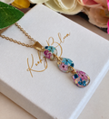 Gold Midnight Plum Tear Drop necklace.
