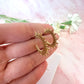 Gold sun ray earrings.