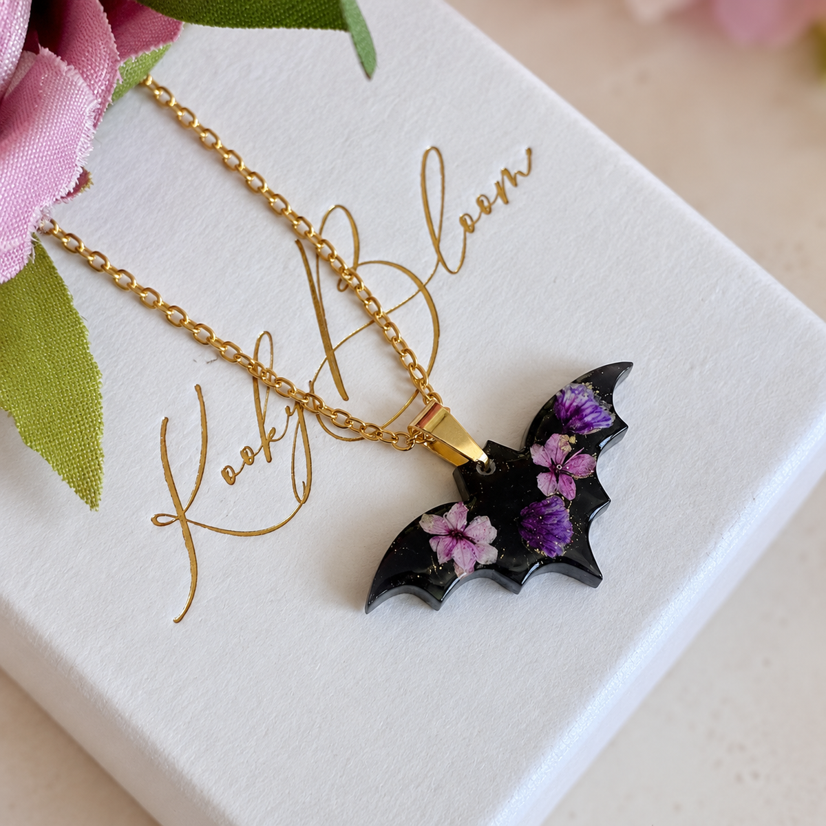 Gold Black Purple bloom Bat necklace.