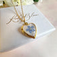 Gold forget me not flower heart locket necklace.