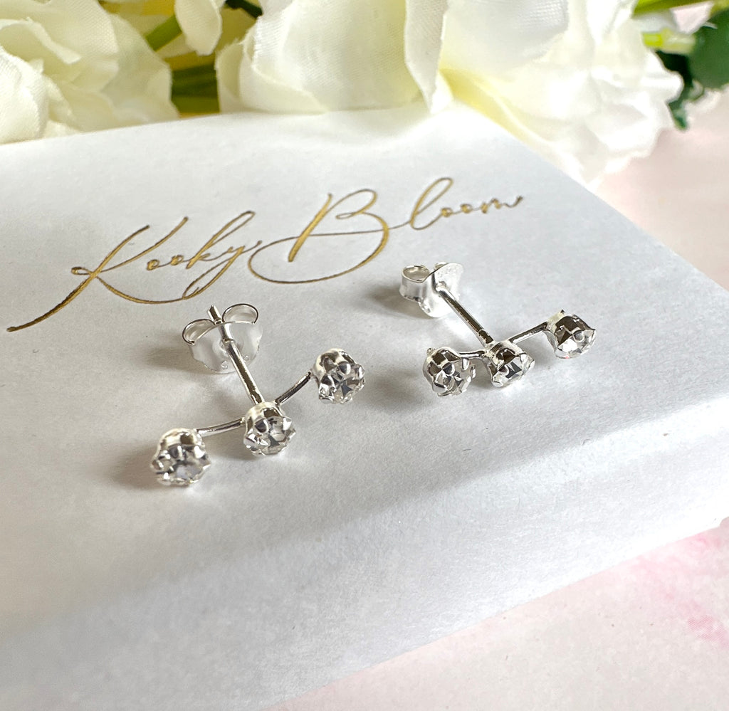 925 sterling silver Triple CZ climber stud earrings.