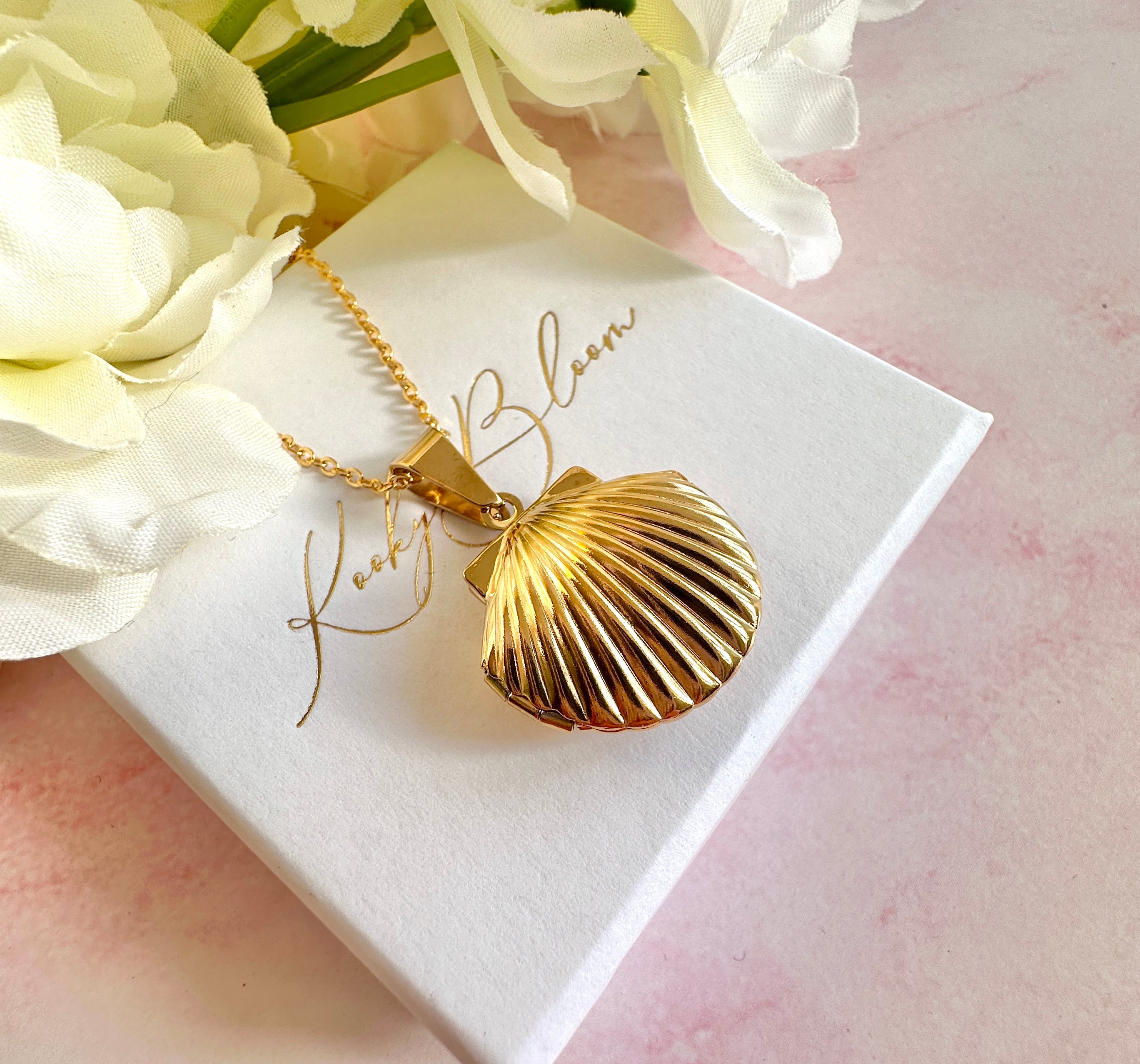 Gold Seashell Locket necklace.