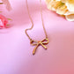 Gold Bow necklace.