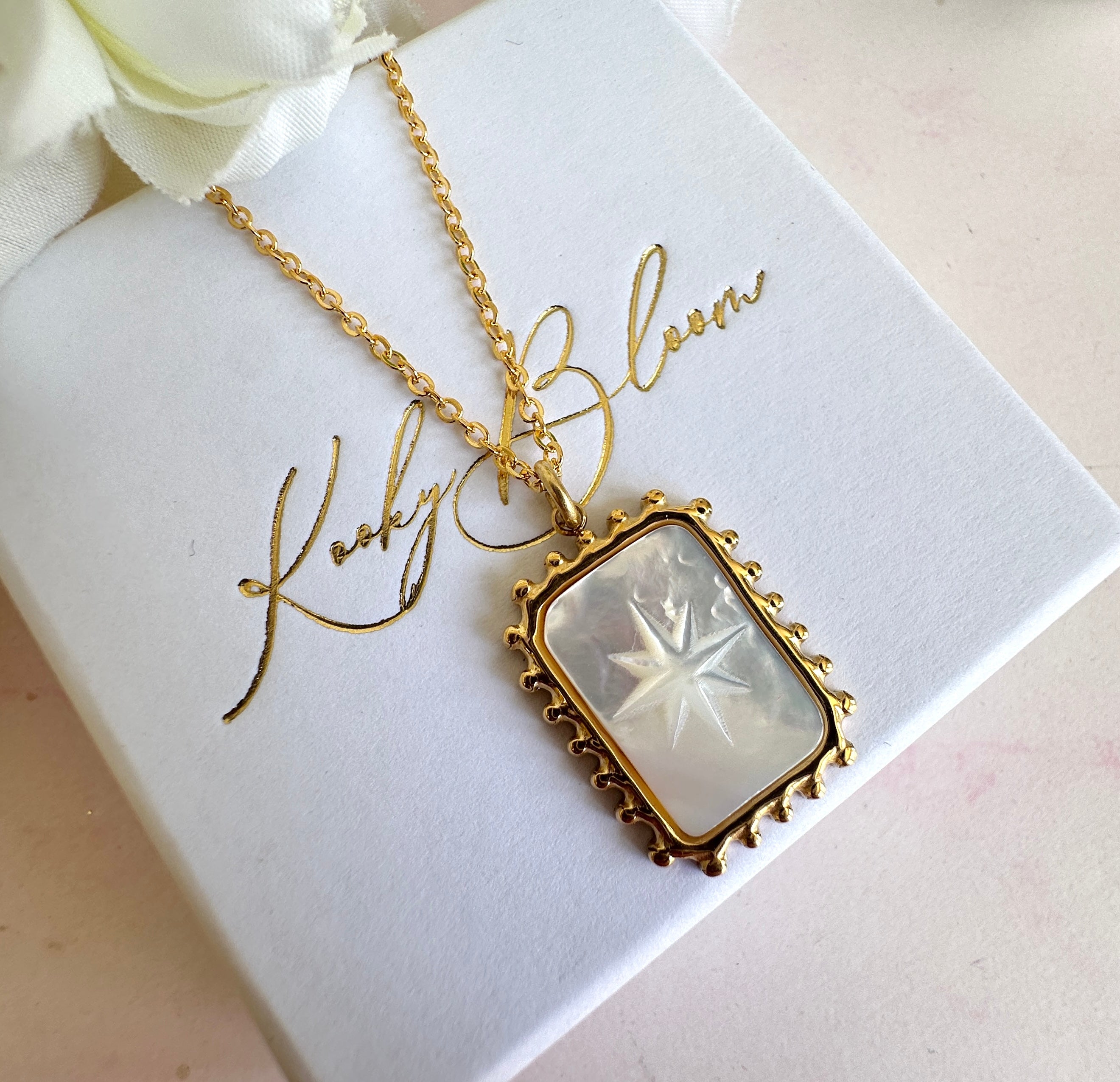 Gold engraved Star shell rectangle necklace.