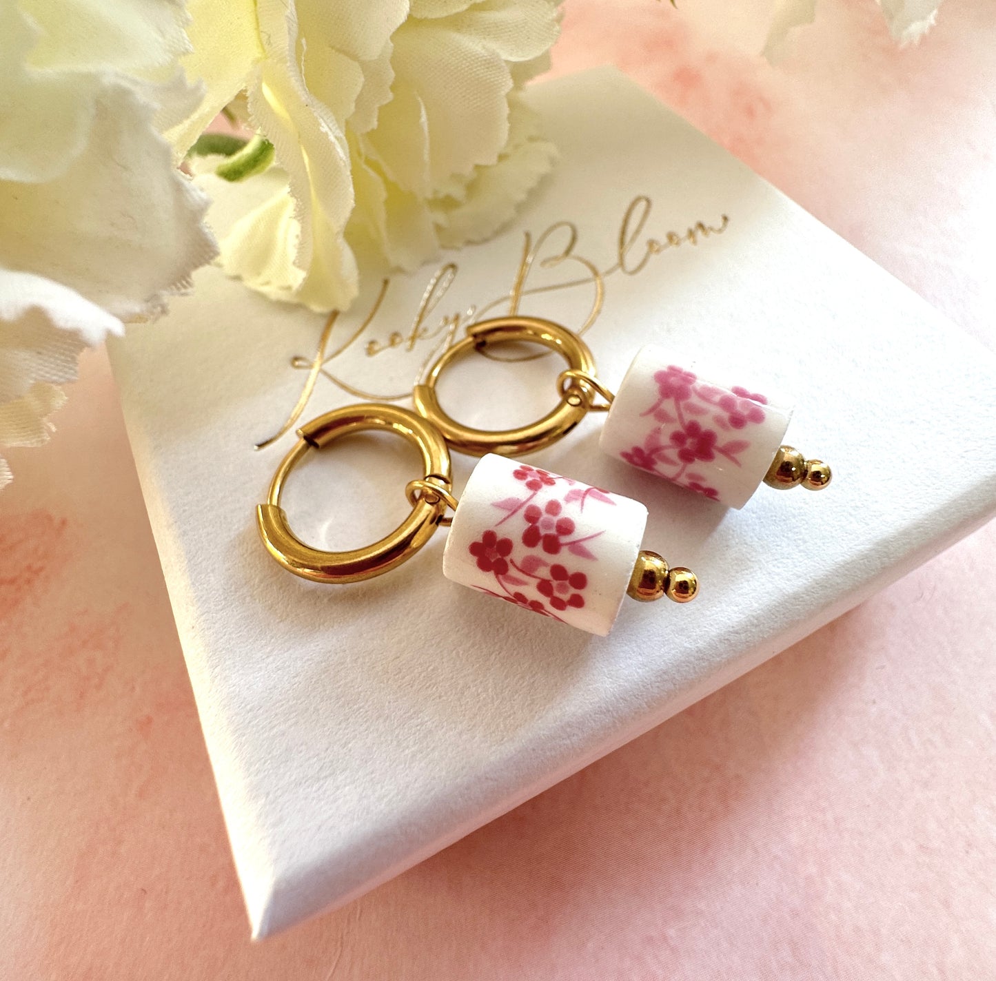 Gold pink floral ceramic bead earrings.