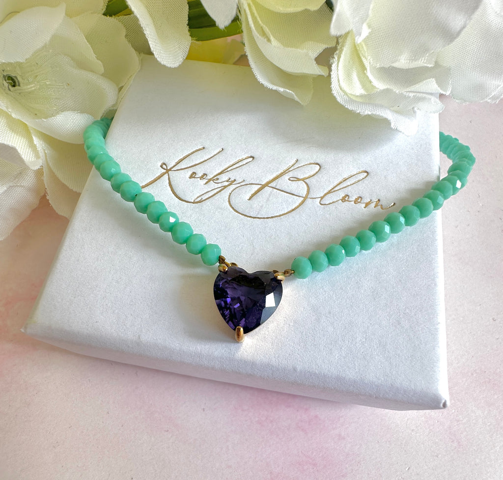 Gold turquoise beaded Purple CZ heart necklace.