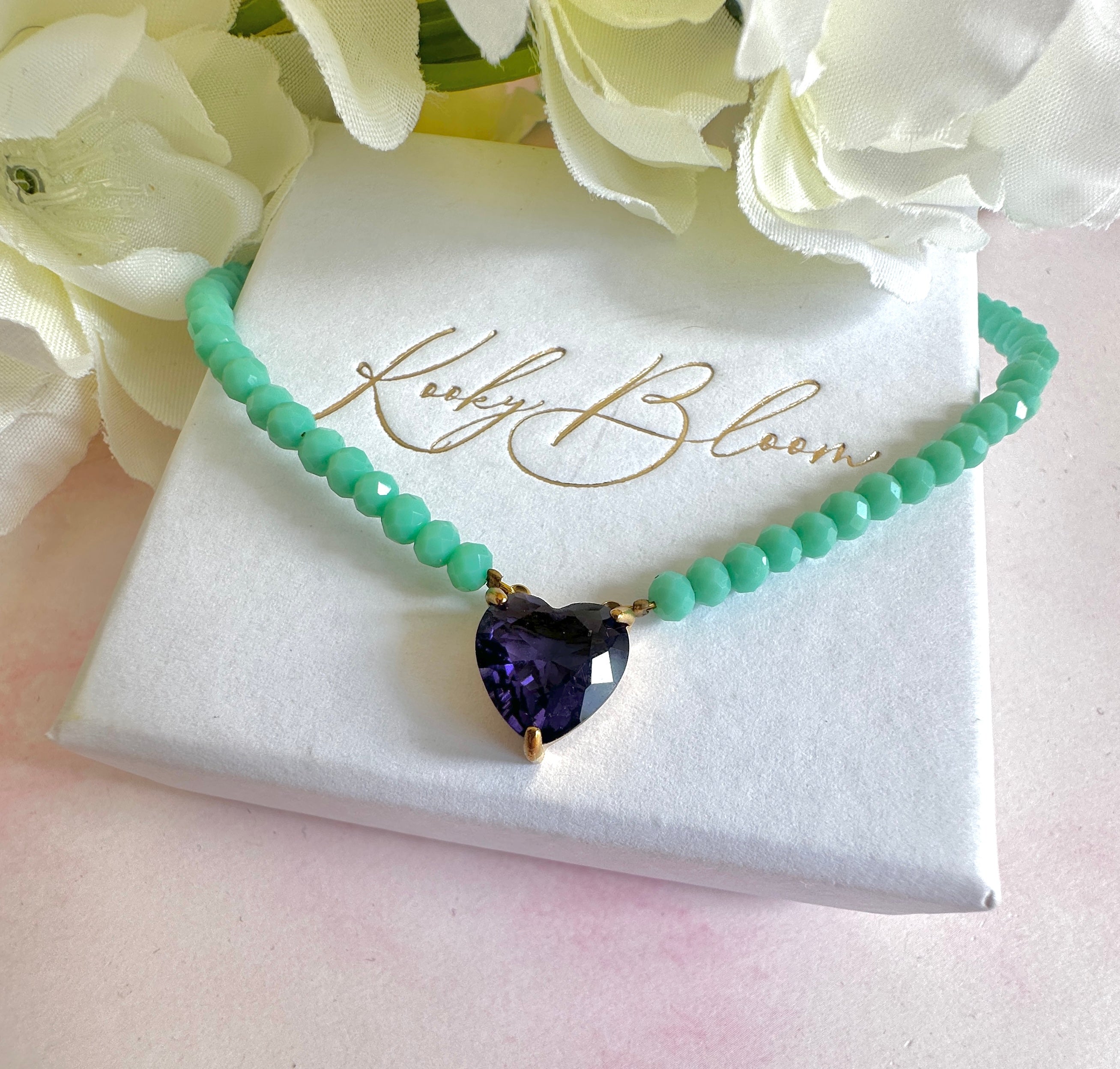 Gold turquoise beaded Purple CZ heart necklace.