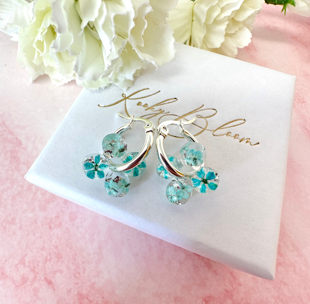 Tiny ice Blue Bloom flower Clover hoop earrings.