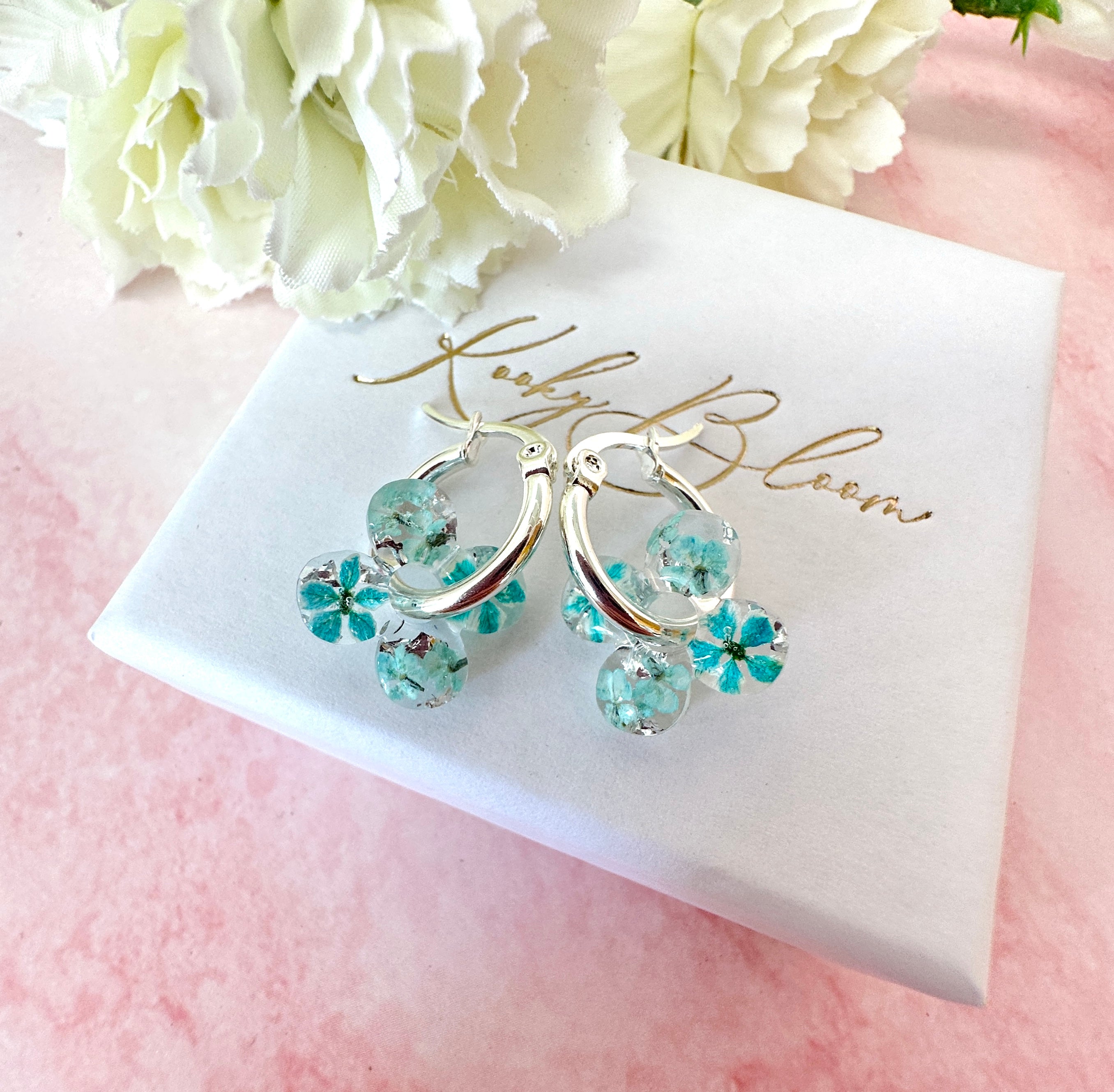 Tiny ice Blue Bloom flower Clover hoop earrings.