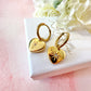 Gold Heart Engraved star Huggie hoop earrings.