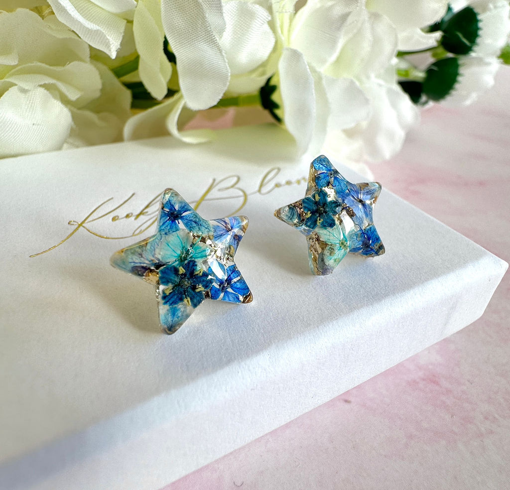 Blue Bloom Star 925 sterling stud earrings.