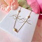 Gold dainty engraved star diamond necklace.