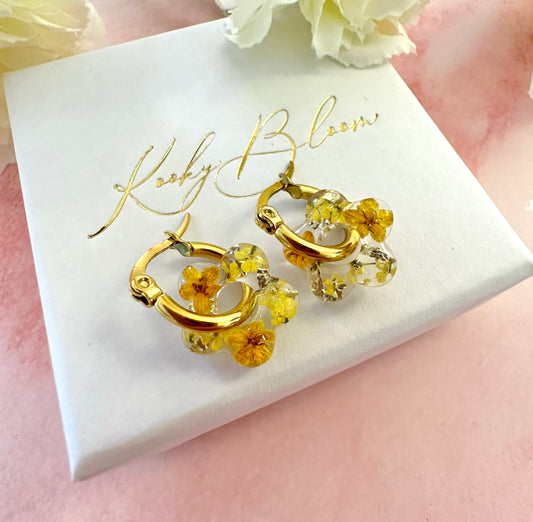 Tiny Yellow bloom flower earrings.