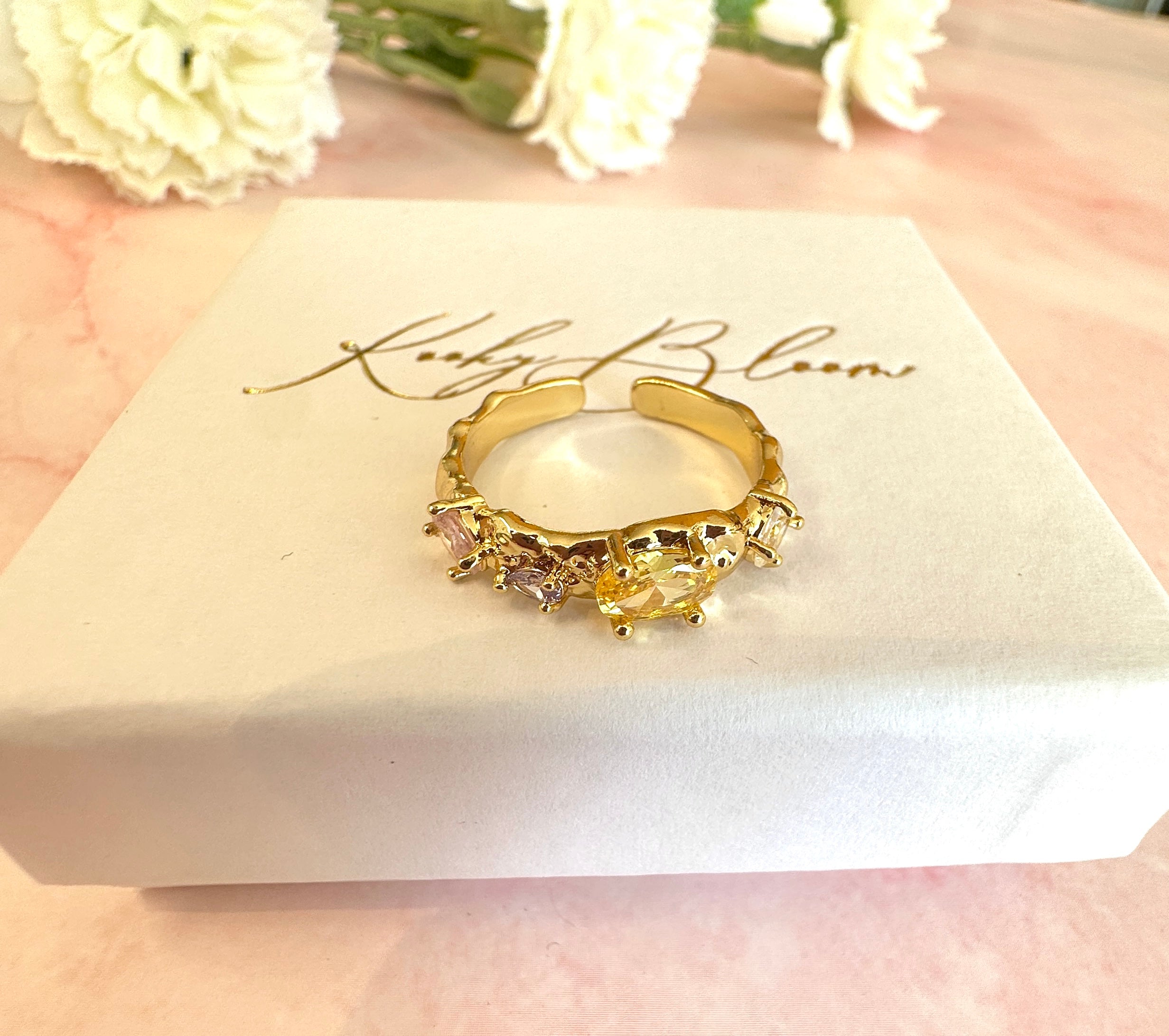 Gold pastel CZ adjustable ring.