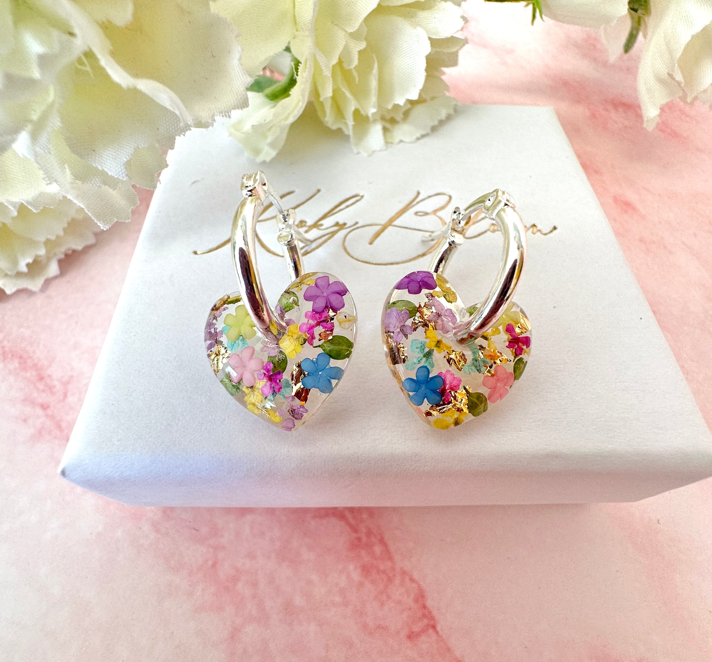 Rainbow Burst bloom heart hoop earrings.