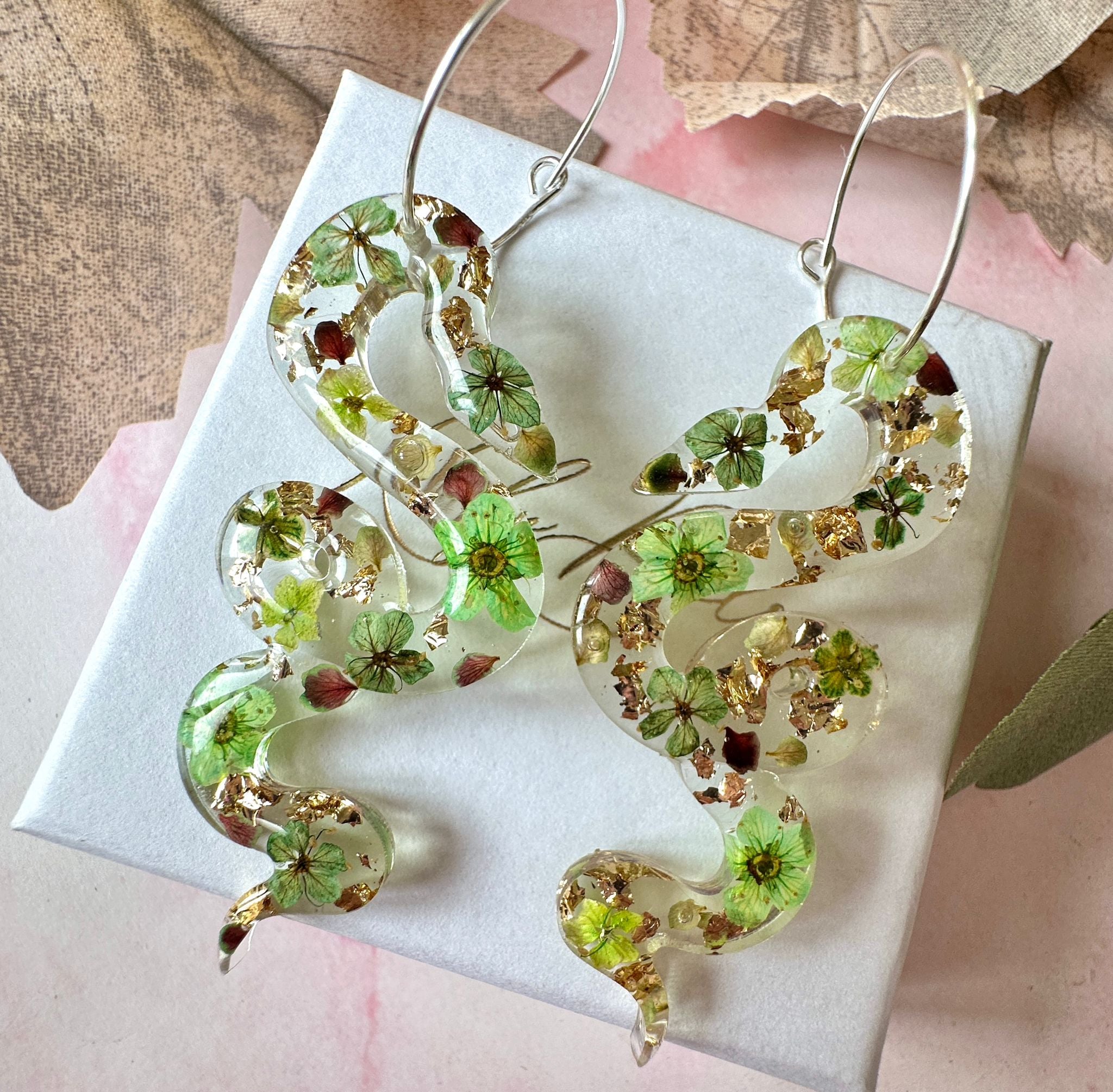 Snake real flower hoop earrings.