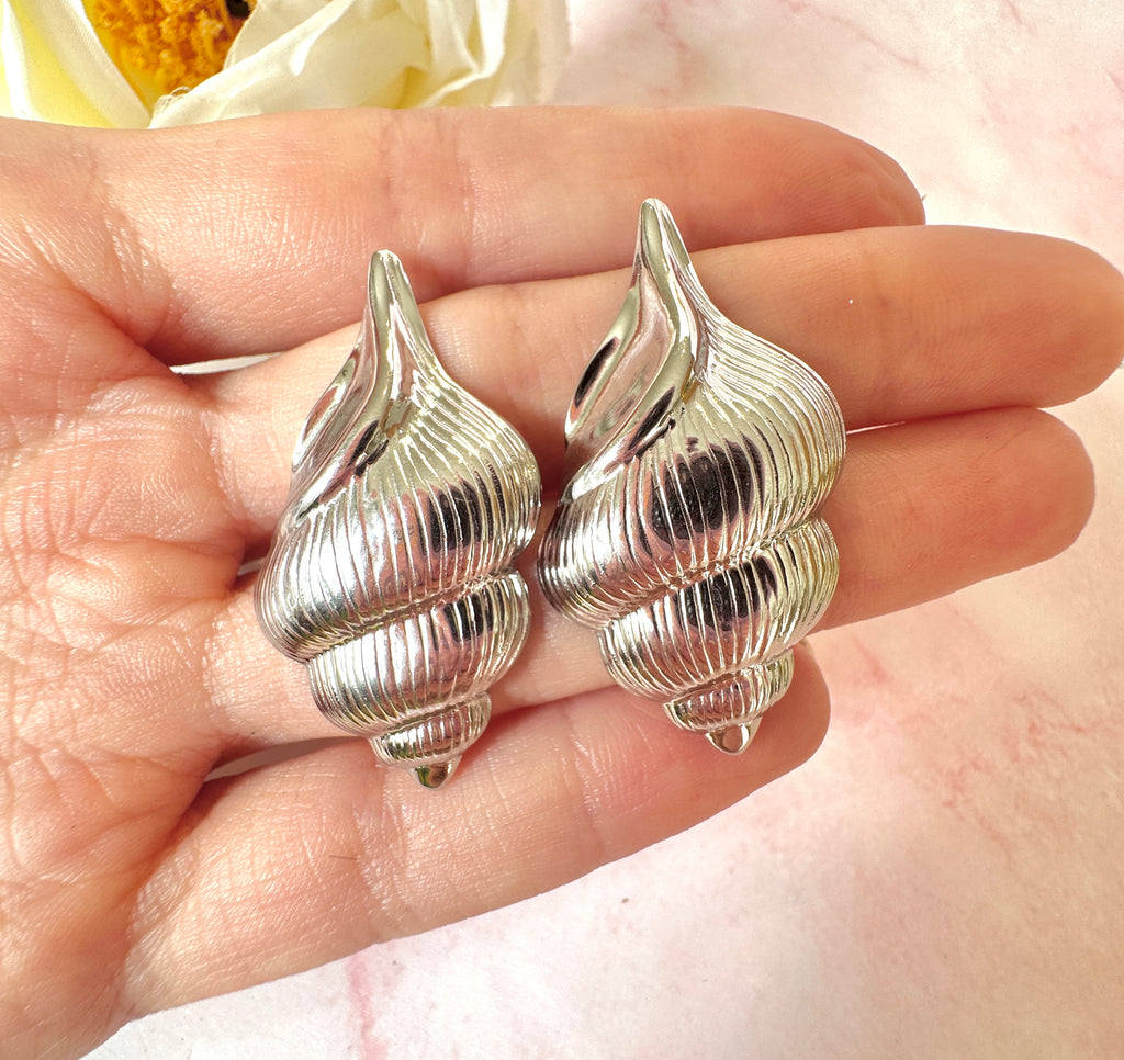 Silver oversized Seashell stud earrings.