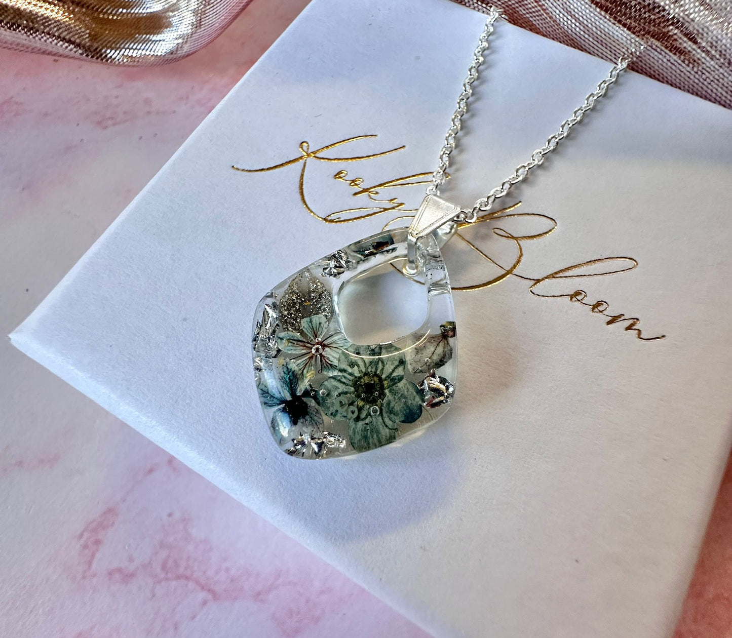 Silver Frosted floral diamond necklace.