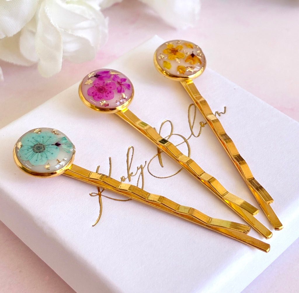 Gold set of 3 Bloom flower hair slides.