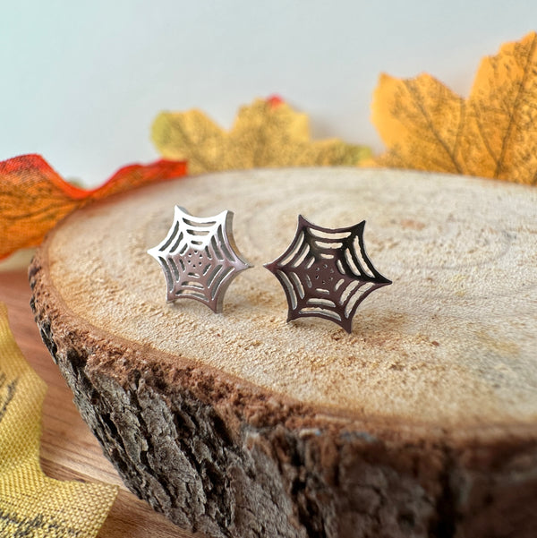 Silver Cobweb stud earrings.