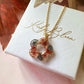 Gold Ember Bloom flower necklace.