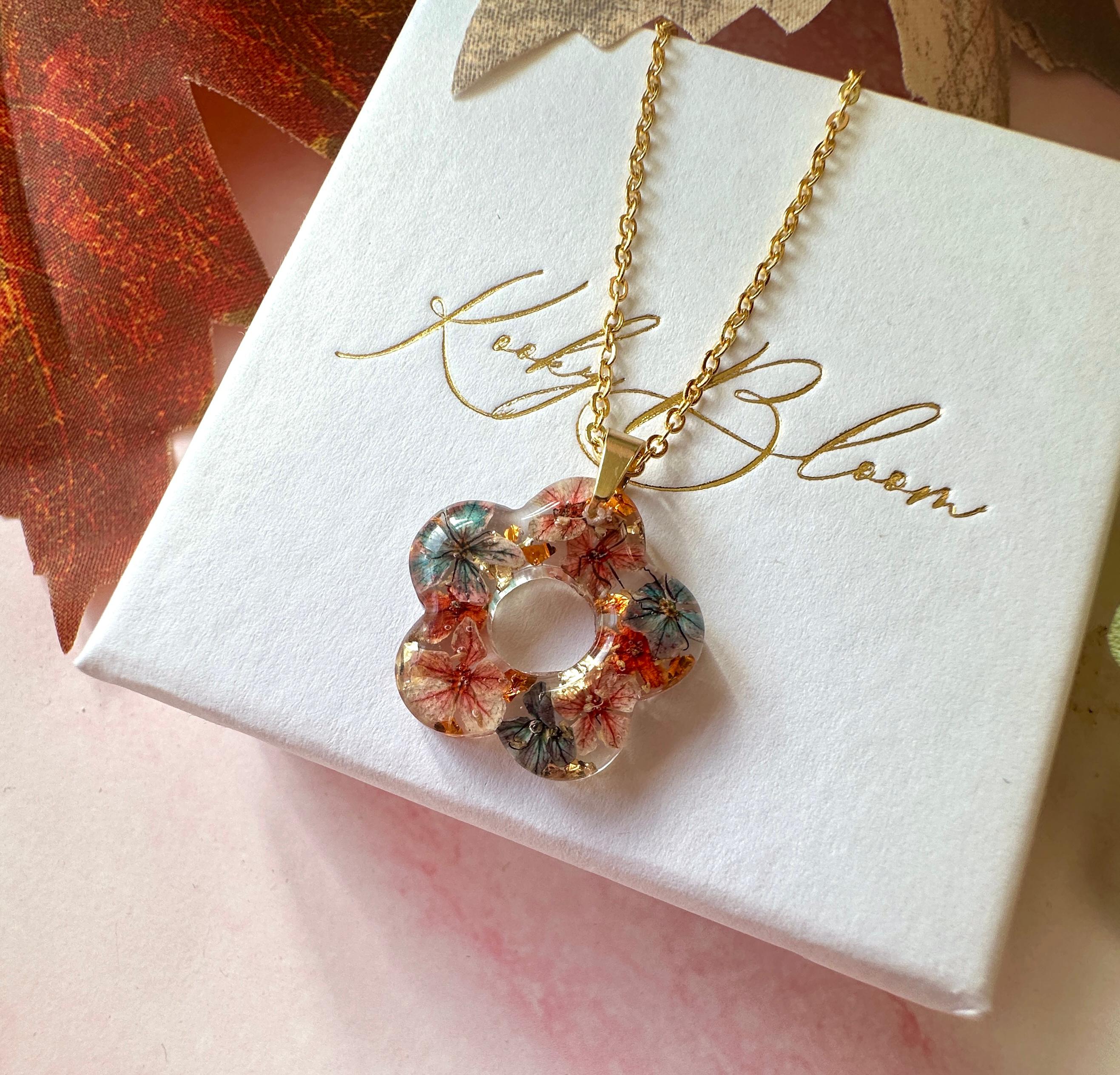 Gold Ember Bloom flower necklace.