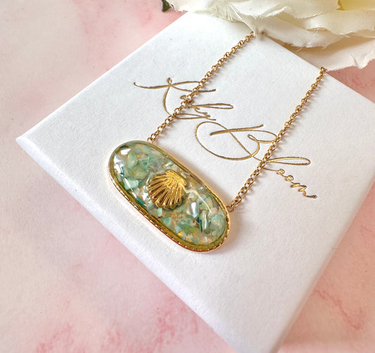 Gold Oval Shell necklace.
