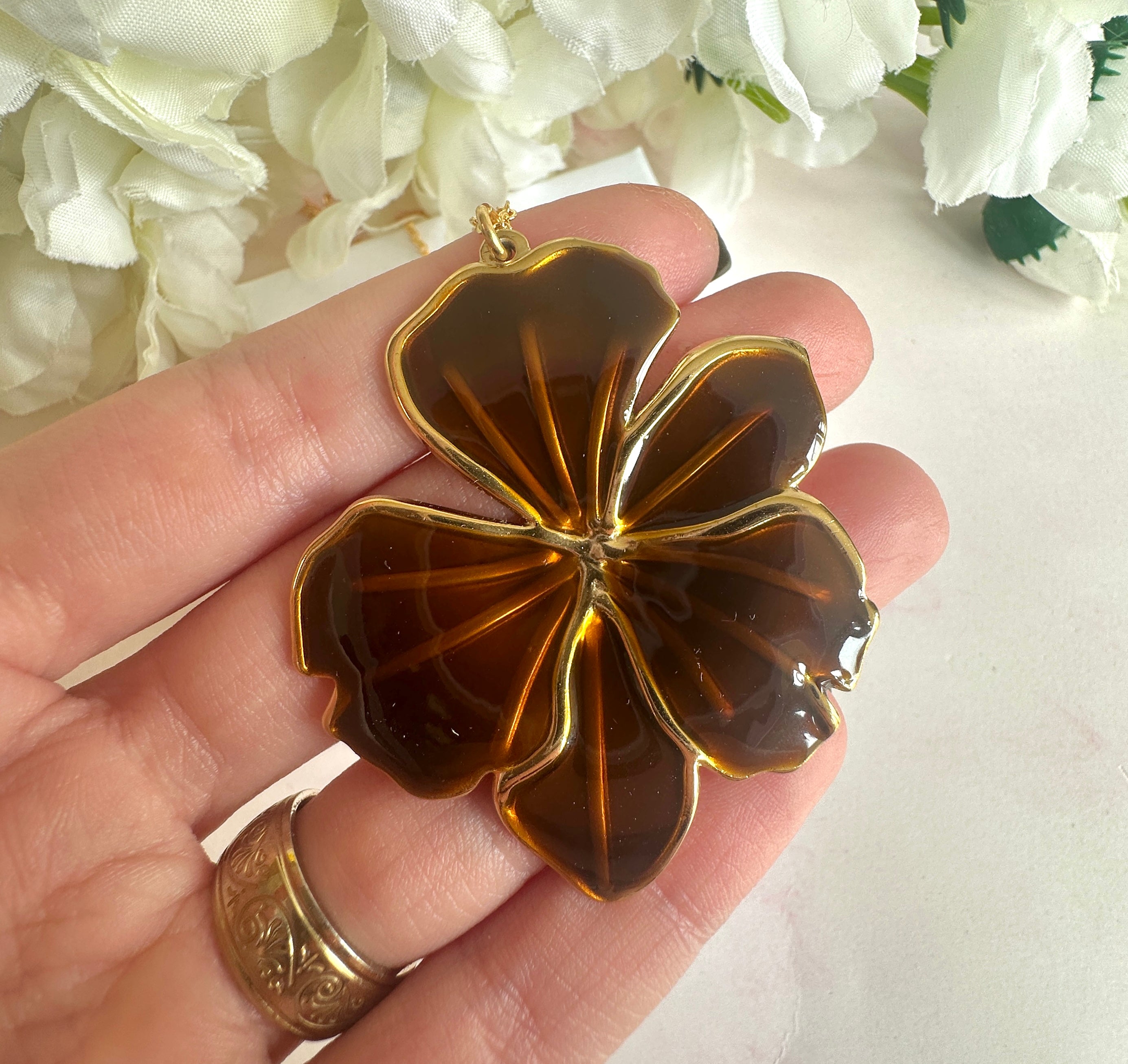Gold brown oversized flower necklace.