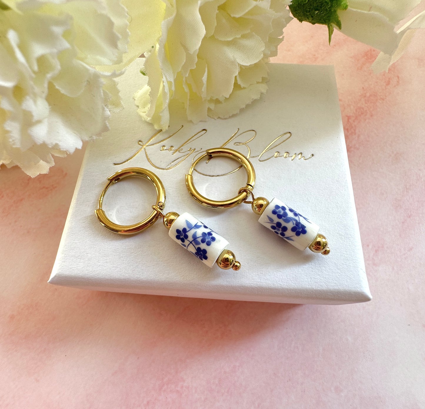 Gold blue floral ceramic bead earrings.